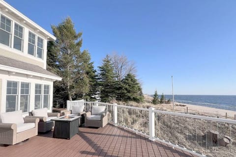 Enjoy panoramic views from the main level deck. Outdoor seating, fire table, and dinning table are all available on this spacious deck!