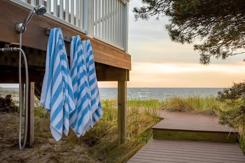 An outdoor shower to rinse off sandy toes. Beach towels provided at the house.