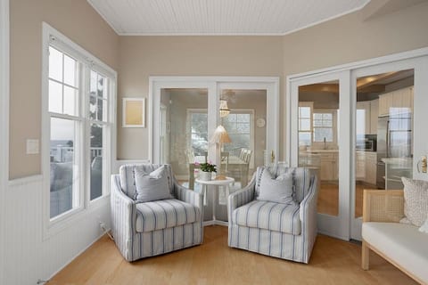 The sunroom provides a cozy spot to enjoy Lake Michigan at any time of day or season.