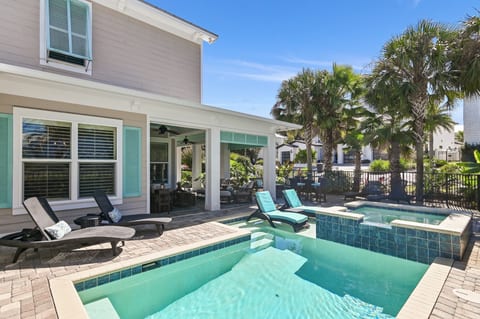 Pool area with pool chairs, shallow lounging area