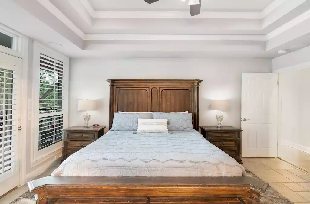 Primary suite features a king bed and tons of natural light. Bedroom #1. - Main House at Whispering Oaks Estate - Dripping Springs