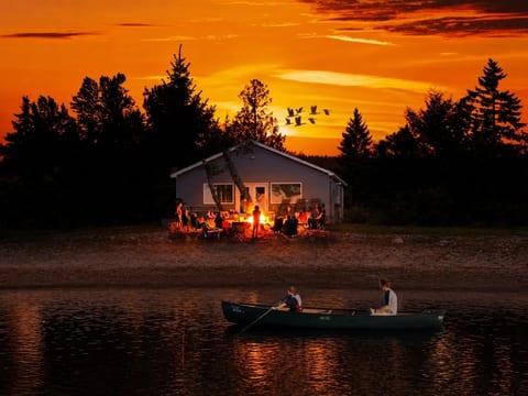 Cozy Home II sunset. People around the firepit
