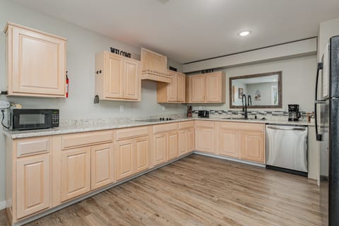 Kitchen fully stocked with dishwasher