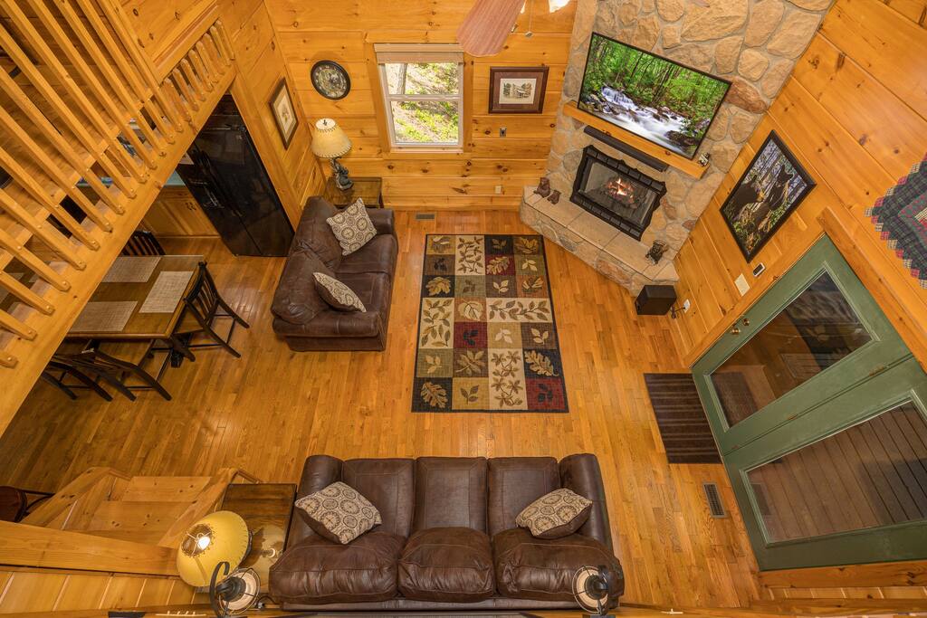 View from loft overlooking living room - Secluded Luxury 2 Bdrm Cabin w/Theatre Room & Pond - Sevierville