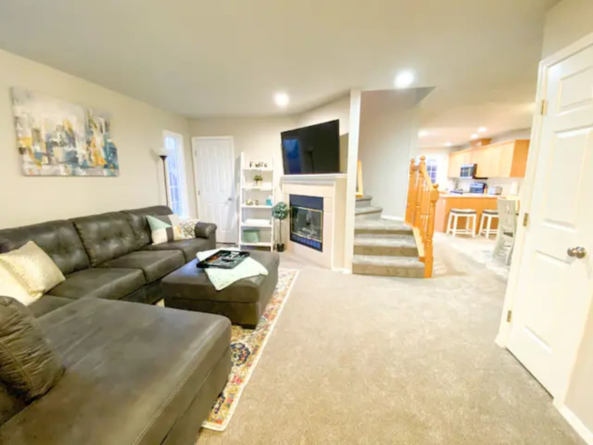 Entryway View: Huge sectional, TV, room to gather