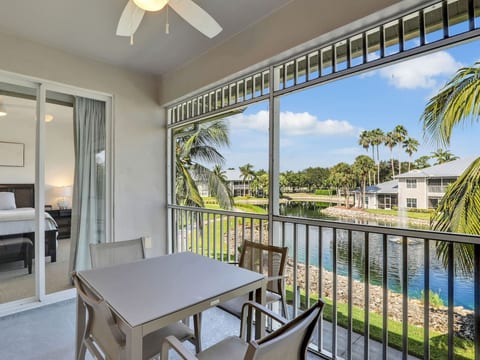 Balcony with seating area overlooking the water