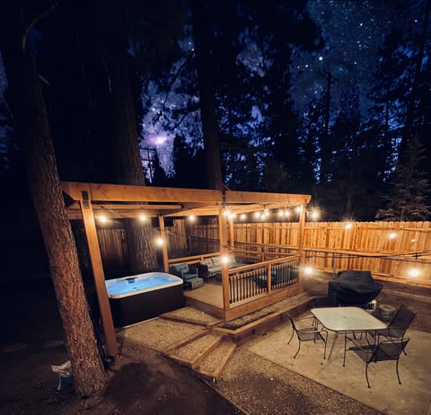 Stargazing backyard with hot tub