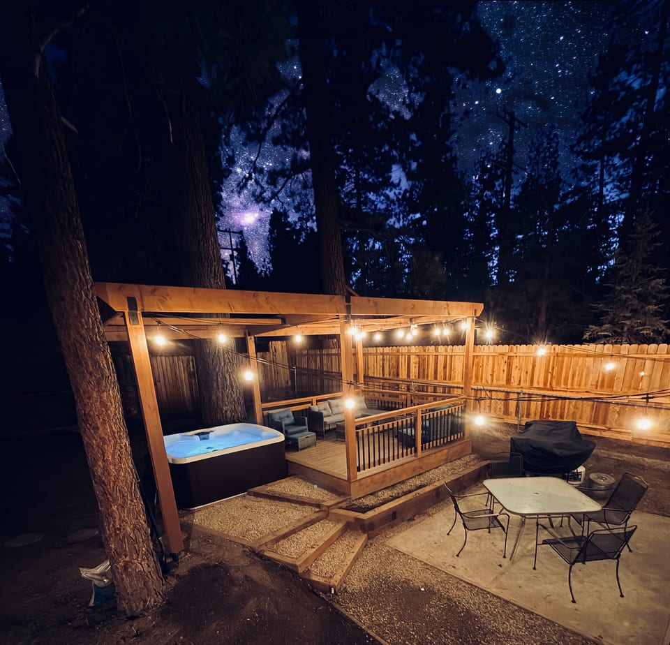 Stargazing backyard with hot tub