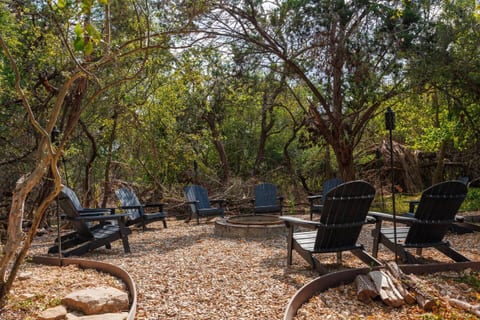 Nestled amongst the trees, the fire pit feels like you are inside a state park. Gather around, come prepared for smores and fun
