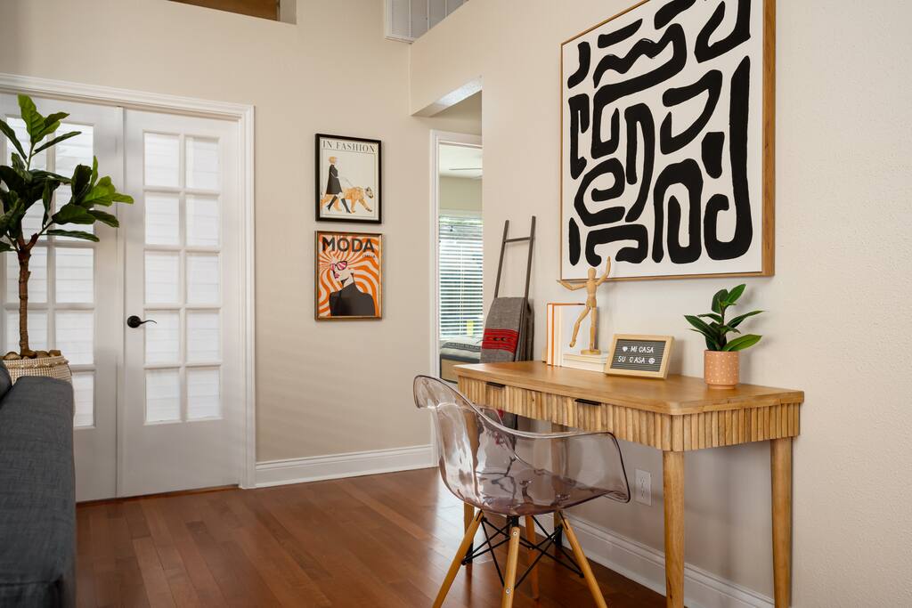 Maximize your productivity in this living room workspace, designed for comfort and focus with a stylish desk and modern décor