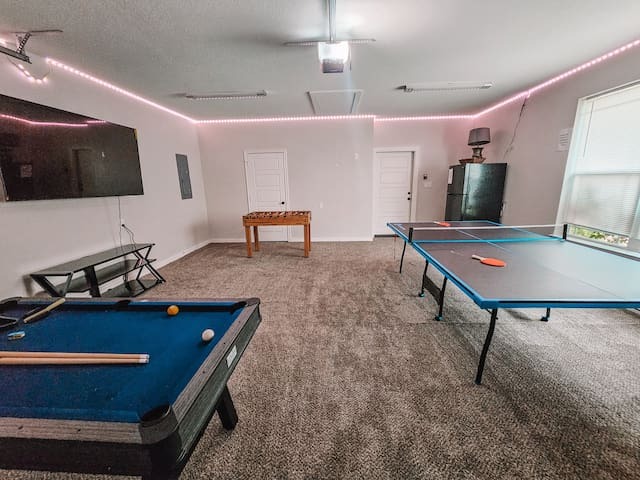 Game Room w/ ping pong table, pool table, foosball, & 70'' TV