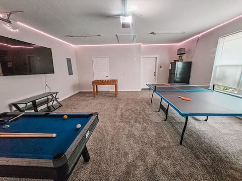 Game Room w/ ping pong table, pool table, foosball, & 70'' TV