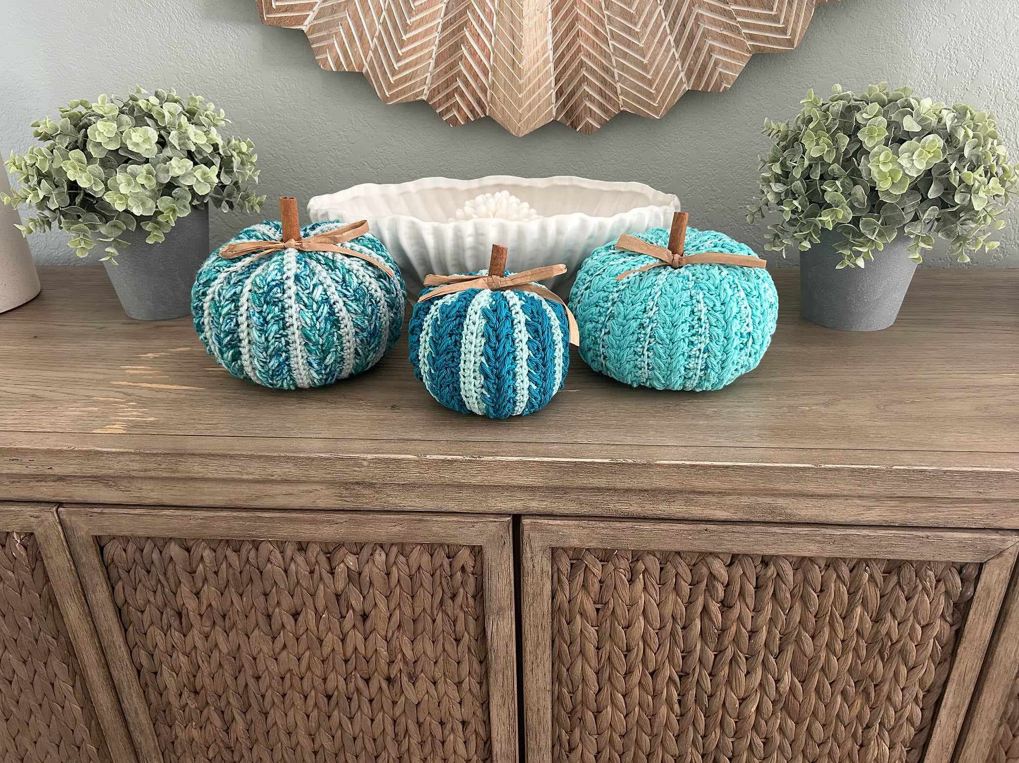 Blue costal pumpkins adorned in fall vibes.