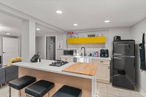The kitchen has a large cutting board, two gas burners, and all essential cookware and dishware. We also include a coffee maker, both a drip coffee maker and an espresso maker.