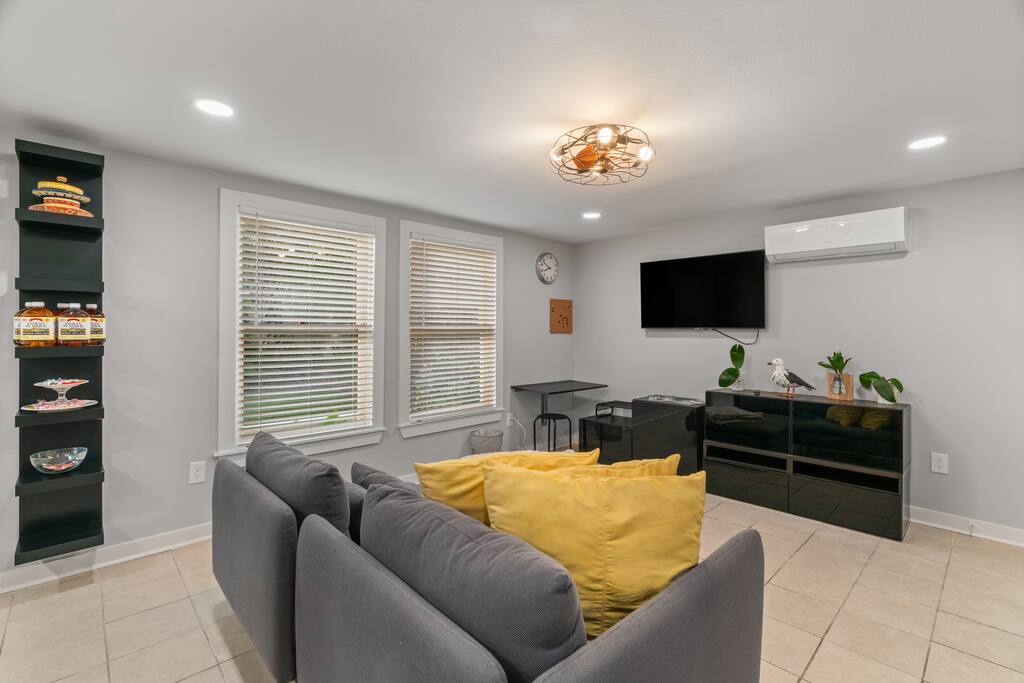 The living room has a mini split to control your space and plenty of natural light with the two large windows. 