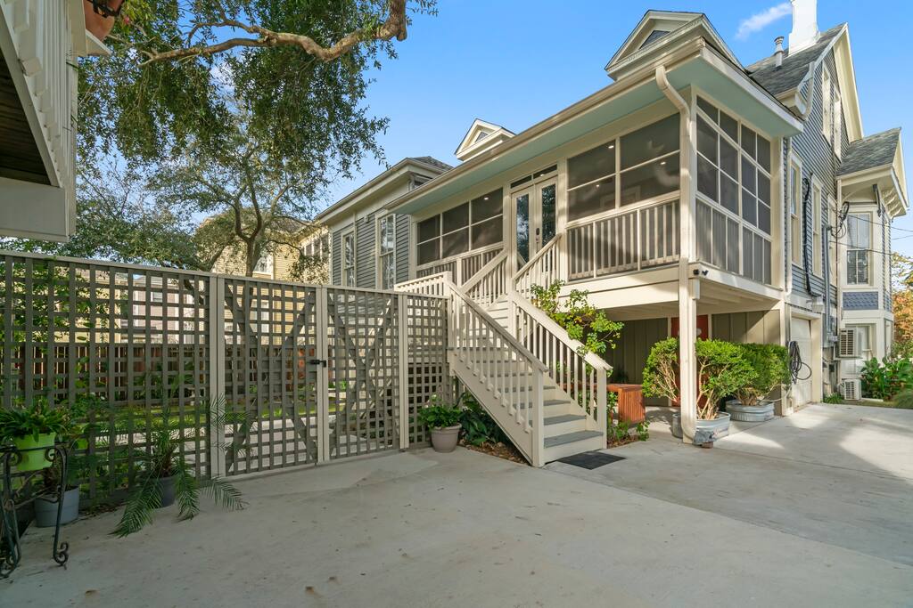 The studio is on the first floor below the screened-in patio. 