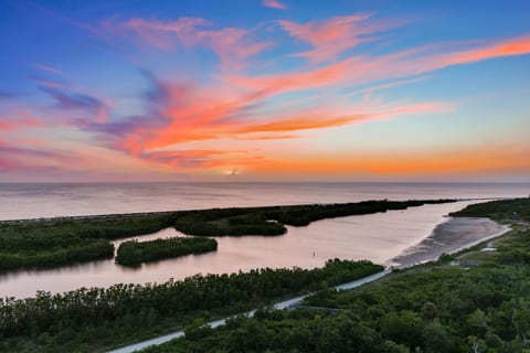 Stunning sunsets from the balcony, living area and primary bedroom