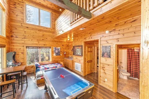 Game room with Air Hockey and Foosball Tables with Roku TV