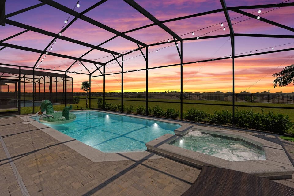 Enjoy a beautiful sunset from your private pool with no rear neighbors and a view of the nightly fireworks from Disney.  Bistro lights, palm trees, outdoor games, outdoor seating, sofa, TV and mini fridge complete this outdoor oasis!