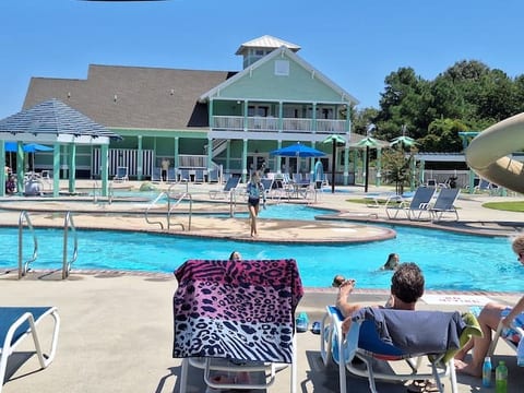 Resort style pool w/ zero edge entry, splash pad, shallows, lazy river, and water slide.