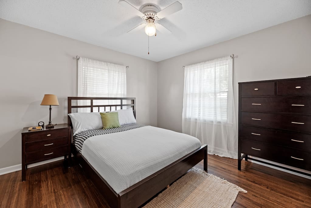 One of the bedrooms with plenty of natural light coming into the room and storage for clothing!