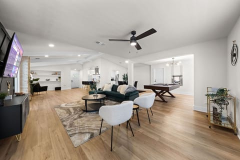 Escape to your own private oasis at our stunning vacation home, featuring a spacious and inviting great room that's perfect for family gatherings. Relax and unwind in style while taking in breathtaking views
