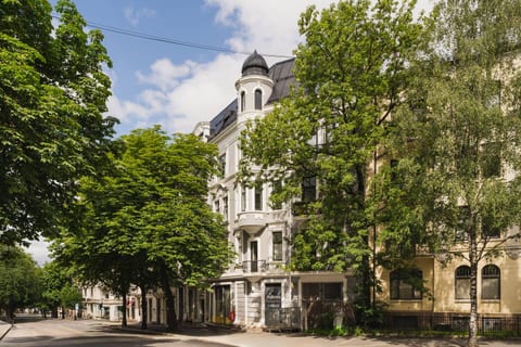 This beautiful 1890s building houses your third-floor apartment. A grocery store on the ground floor adds convenience for your stay.
