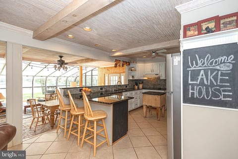 Shot of the kitchen and sunroom