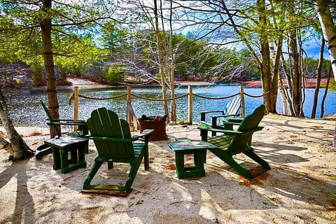 Your large beach and dock with sandy bottom just steps from the house and a firepit overlooking the cove to enjoy s’mores and nature at its best!