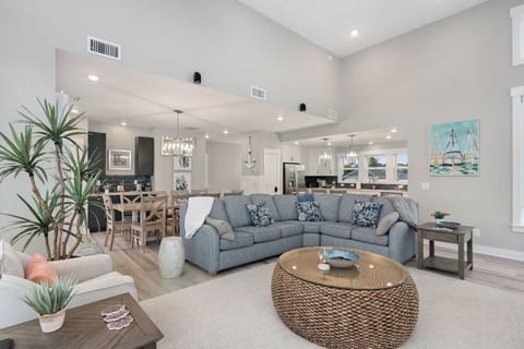 Bright living room w/ plush sectional, coastal accents & an easy, relaxed vibe.