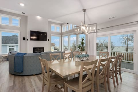 Open living & dining area filled w/ natural light, ideal for gathering & unwinding.