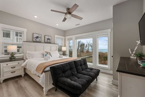 Serene bedroom retreat w/ soft tones, comfy bedding & a calm, airy feel.