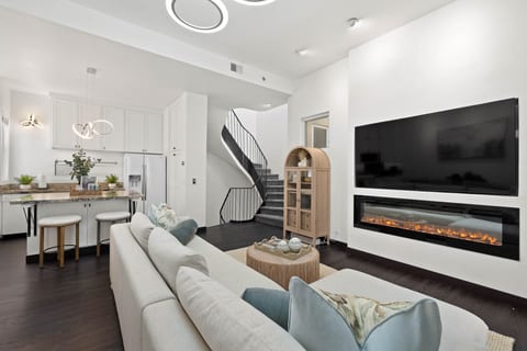 Stylish living room w/ TV, plush seating & a bright, open layout for unwinding.