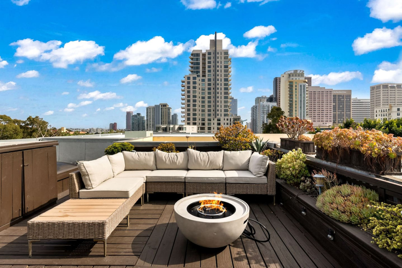 Bright rooftop view overlooking the city skyline, a relaxing spot to soak up sunshine & urban energy.