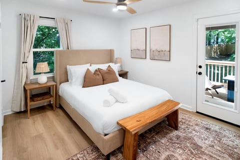 Serene bedroom w/ crisp linens, soft textures, and calming tones for restful nights.