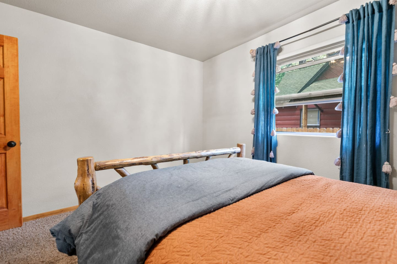 Big Bear vacation rental with hot tub and game room, close to lake, ski resorts, and trails. By Rather Be Properties