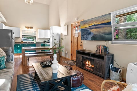 Inviting living room w/ fireplace, comfy couches, & rustic touches for laid-back evenings.