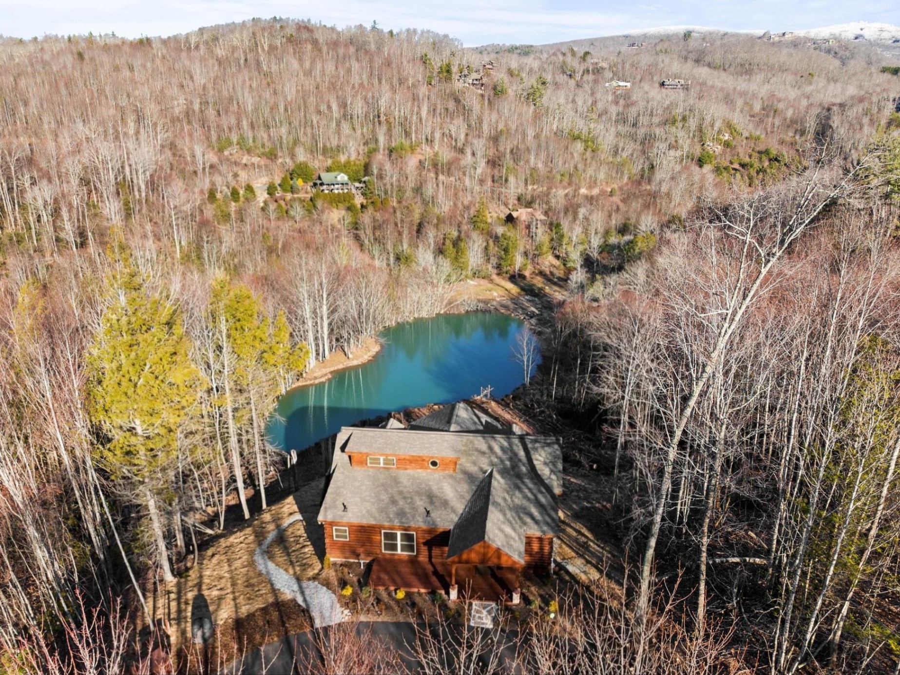 Aerial view of cabin with lakefront. Kayaks and paddleboards are welcome