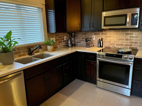 Fully stocked kitchen with high end appliances along with instapot, juicer, vitamix, berkey water filter, chefs knives, coffee grinder, keurig, drip coffee maker, etc.