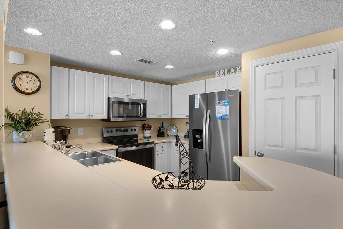 Full kitchen with stainless steel appliances. 