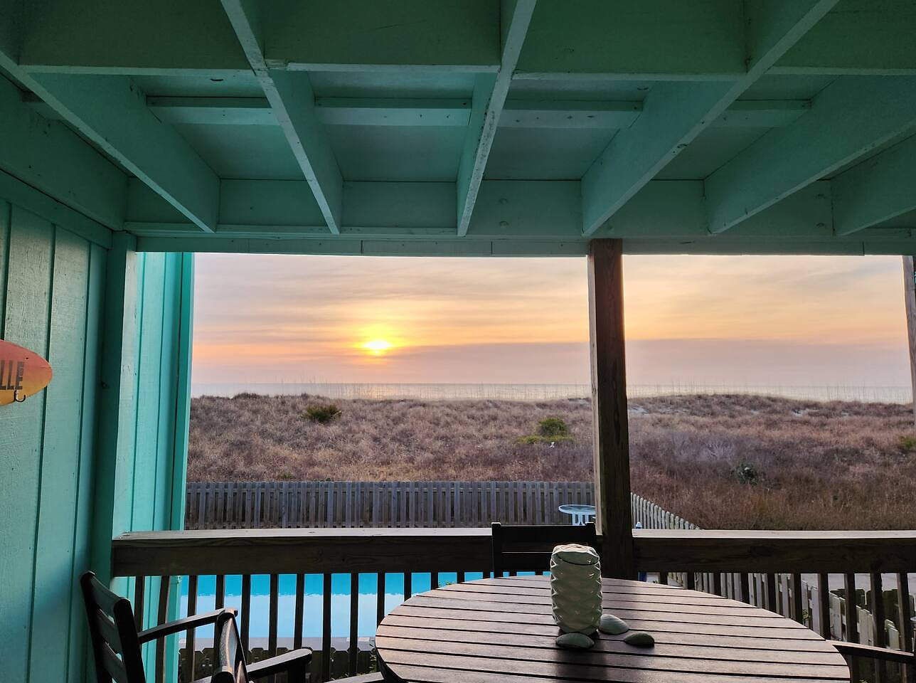 Enjoy views of the pool and beautiful sun and skies over the ocean right from your deck.