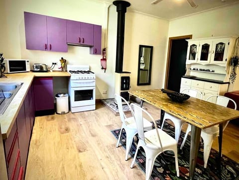 Kitchen and dining area, with our new efficient heater. (wood)