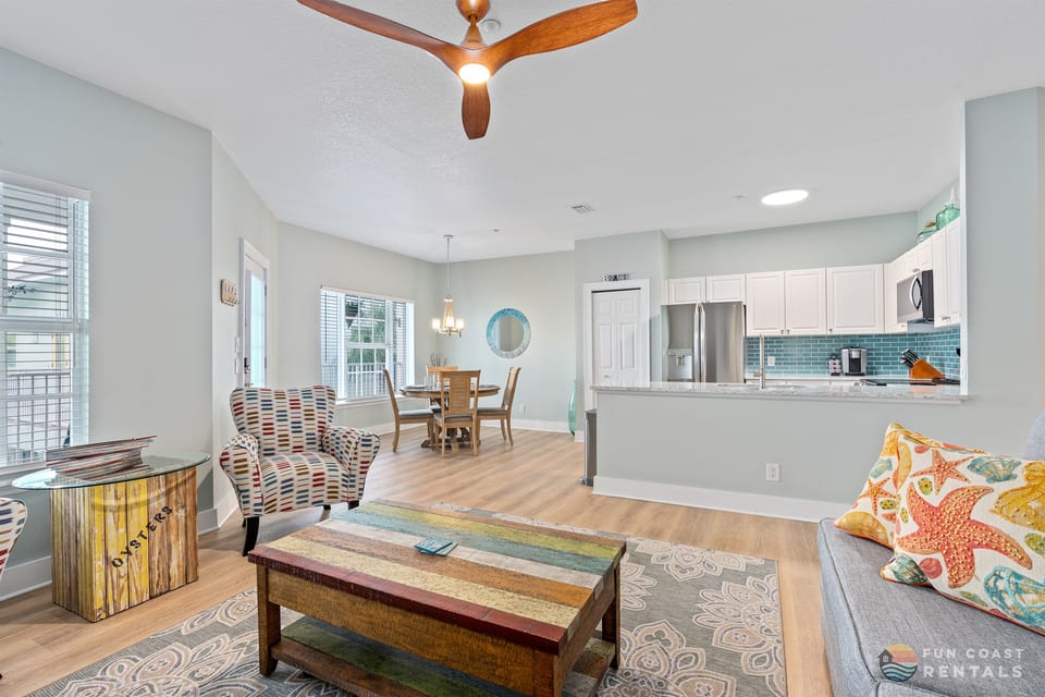 Inviting Living Room with Ample Seating, Kitchen & Dining Area