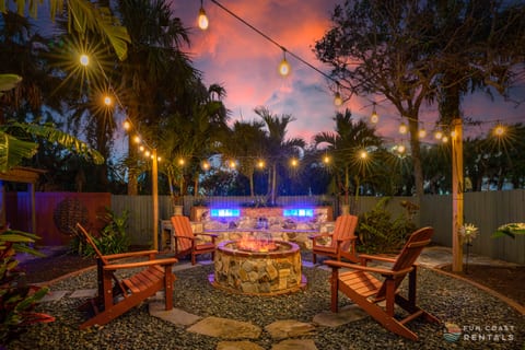 Private and inviting string lit zen Backyard with wood fire pit!