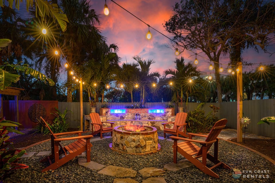 Private and inviting string lit zen Backyard with wood fire pit!