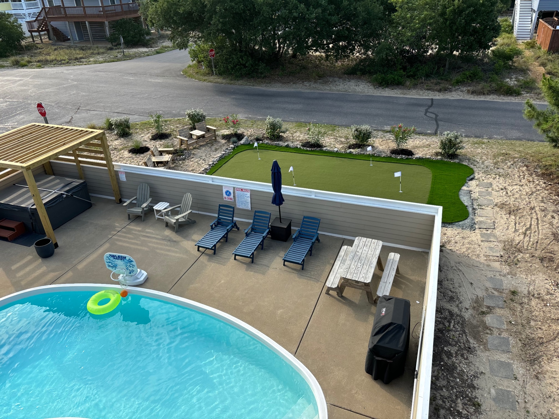 View of the hot tub, pool and 4-hole putting green from the 3rd floor balcony 