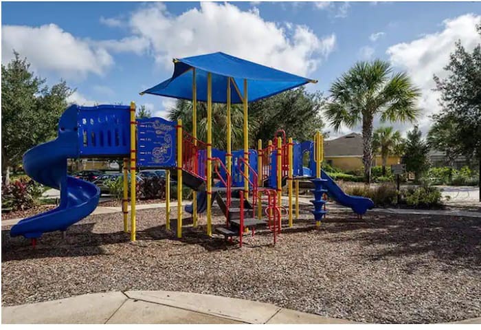 Community playground Community playground - Stylish Villa in Watersong -4bd/3ba, Pool & Spa - Davenport