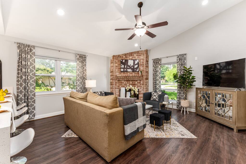 A large TV makes this room perfect for relaxing and enjoying your favorite shows in a stylish and comfortable setting with outside views