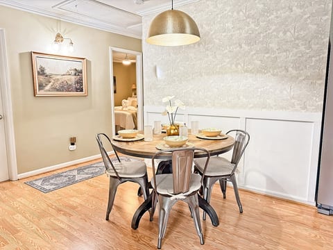 Custom wallpaper and elevated decor turn every meal into something special. 6 chairs available (4 pictured here) + a travel high chair to place on top of a dining chair or to take out to dinner with you!