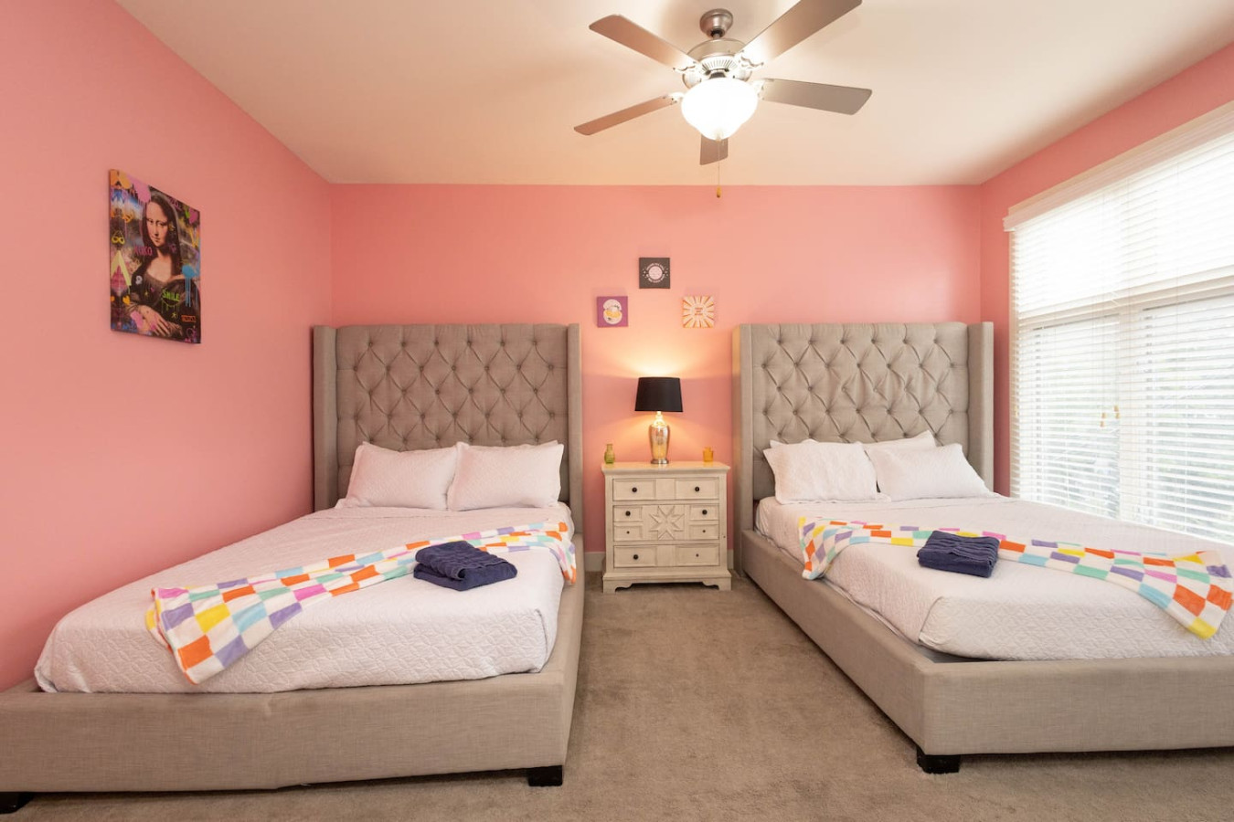 Two elegant tufted queen beds make this room ideal for sharing. Bright, girly, and spacious, it’s perfect for late-night chats and early-morning glam sessions.
